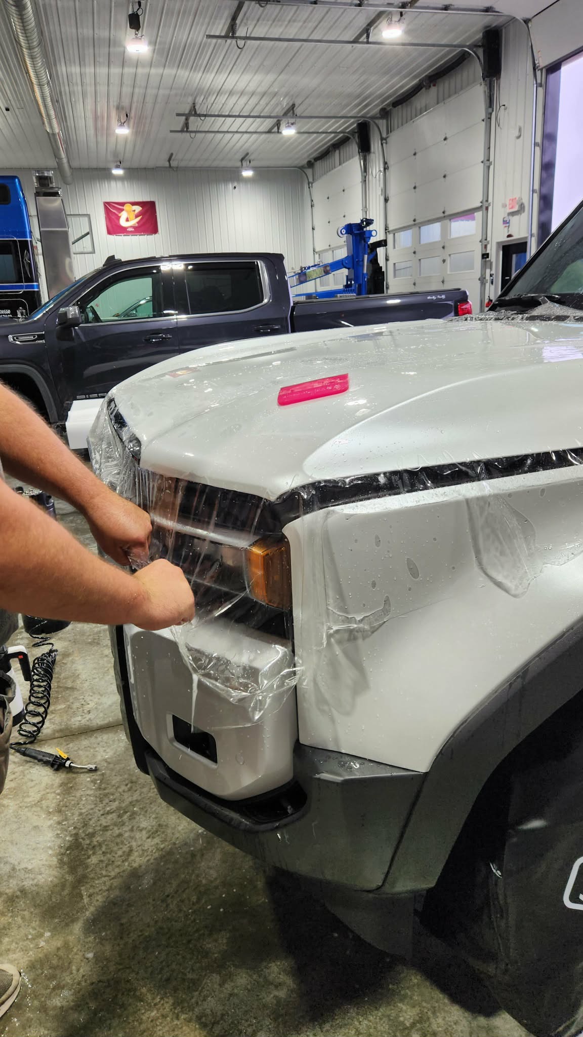 White Chevrolet Colorado headlight protection